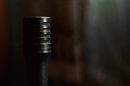 Vintage retro microphone isolated on black backgroundの写真素材