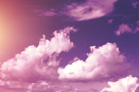 Creative background, pink, fluffy, vanilla clouds. The concept of lightness, magic, magic, fairy...