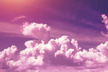 Creative background, pink, fluffy, vanilla clouds. The concept of lightness, magic, magic, fairy tale, good. Background for cards, flyers.の写真素材