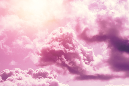 Creative background, pink, fluffy, vanilla clouds. The concept of lightness, magic, magic, fairy tale, good. Background for cards, flyers.の写真素材
