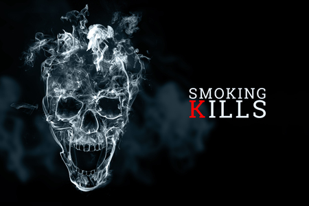 Skull from cigarette smoke on a black background. The inscription smoking kills. Creative background. The concept of smoking kills, nicatine poisons, cancer from smoking, stop smoking. Copy space.の写真素材