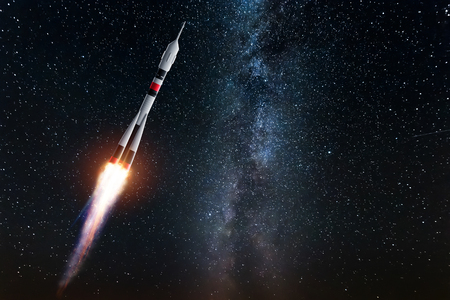 Rocket against the starry sky. The concept of space exploration, satellite launch, flight to the moon, flight to Mars, free internet.  Mixed mediaの写真素材