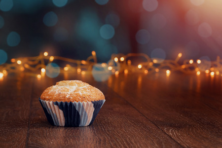 Creative background, cupcake with candles, beautiful bokeh. Happy Birthday. Present. Concept for Holiday Card, Flyer, Background. Copy spaceの写真素材