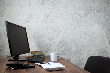 Stylish workspace with computer and posters on home or studioの写真素材