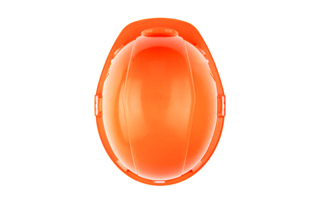 Orange construction helmet on a light background. The concept of architecture, construction, engineering, design. Copy space.の写真素材