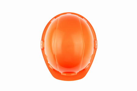 Orange construction helmet on a light background. The concept of architecture, construction, engineering, design. Copy space.の写真素材