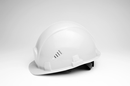 White construction helmet on a light background. The concept of architecture, construction, engineering, design. Copy space.の写真素材