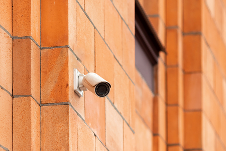Video camera security system on the wall of the building. The concept of video surveillance, surveillance.の写真素材