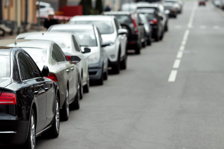 Many cars parked along the road. Lack of, lack of parking in large cities.の写真素材