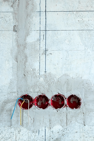 Installing of wall electrical outletの写真素材