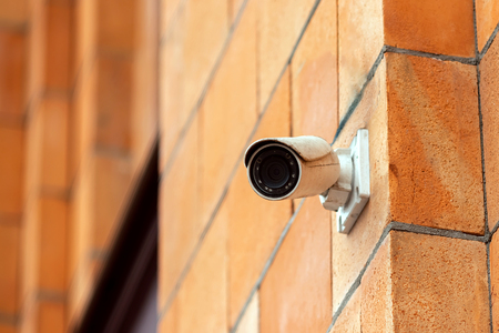 Video camera security system on the wall of the building. The concept of video surveillance, surveillance.の写真素材