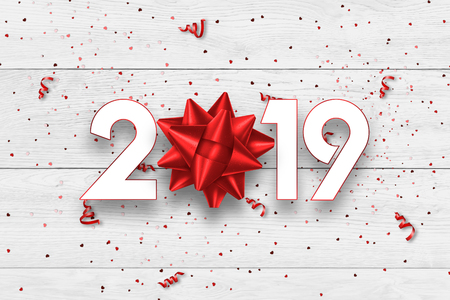 Creative background, numbers 2019 and festive confetti, gift, spiral ribbons on a light background. Happy New Year 2019. Decoration element with tinsel, copy space.の写真素材
