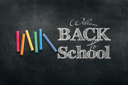 Inscription Back to school, chalk scribble background on blackboard. The concept of the day of knowledge, September 1, the beginning of classes.の写真素材