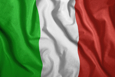 The Italian flag is flying in the wind. Colorful, national flag of Italy. Patriotism, a patriotic symbol. wrinkled clothの写真素材