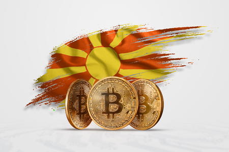 Crypto currency, gold coin BITCOIN BTC. Coin bitcoin against the background of the flag of Macedonia. The concept a new currency, Blockchain Technology , a token.の写真素材