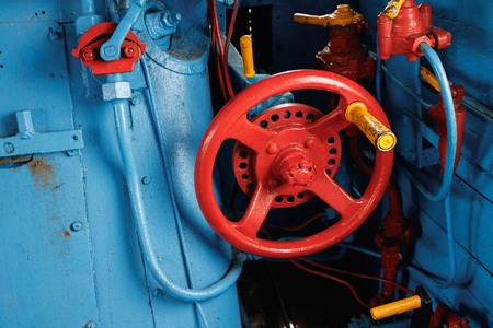 Red valve on a blue background. Cabin of the old train for a couple.の写真素材