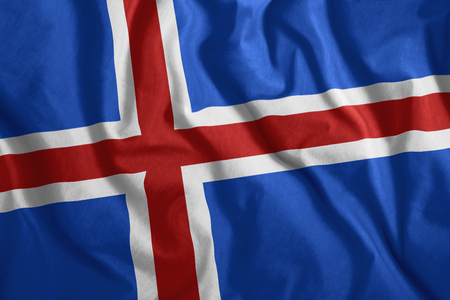 The Icelandic flag flutters in the wind. Colorful, national flag of Iceland. Patriotism, a patriotic symbol.の写真素材