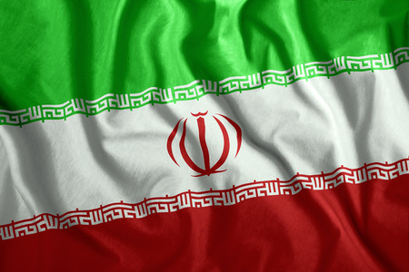 The Iranian flag is flying in the wind. Colorful national flag of Iran. Patriotism, patriotic symbol.の写真素材