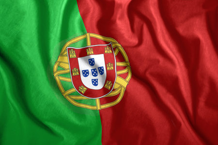 The Portugal flag flies in the wind. Colorful national flag of the Portugal. Patriotism, patriotic symbol.の写真素材