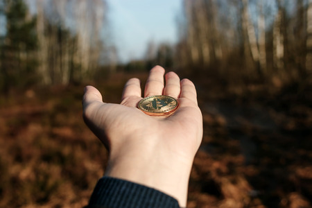 Coin bitcoin on hand. The concept of risk management in money trading in the foreign exchange marketの写真素材
