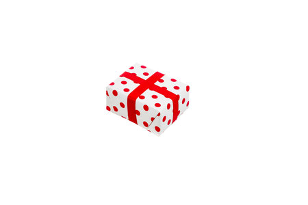 White-red New Year's gift in polka-dot, isolated on white background.