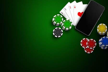 Online casino, mobile casino, mobile phone, chips cards on a green background. Gambling games. View...