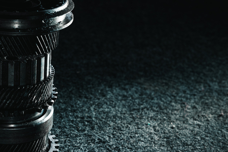 Gears and bearings on a dark background. Automotive concept. Copy spaceの写真素材