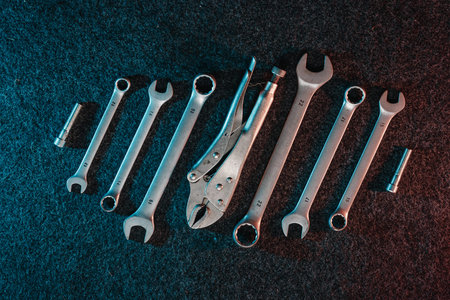 Spanners on a dark background. Top view, flat design. Automotive concept.