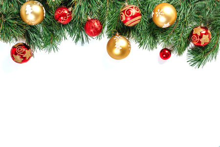 Christmas frame - tree branches with gold and red balls isolated on white background. Isolate.の写真素材