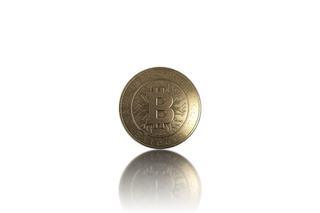 Gold coin Bitcoin on white background. The concept of crypto currency. Blockchain technology.の写真素材
