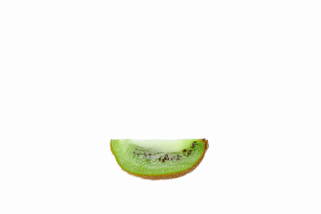 A slice of kiwi isolated on a white background.の写真素材