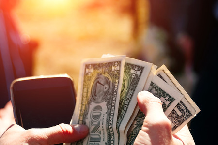 Businessman exchanging money US dollar bills with Euro currencyの写真素材