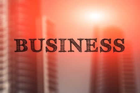 Concept of business, word business on a blurry building backgroundの写真素材