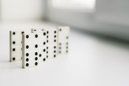 White domino, domino principle, on white backgroundの写真素材