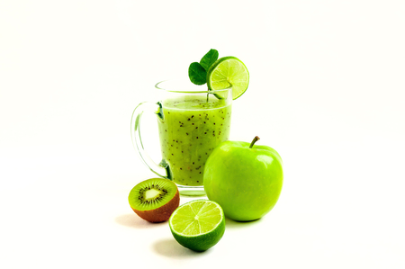 Green healthy cocktail of kiwi, green apple, lime and mint isolated on white background view of a crookの写真素材