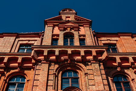 Facade of an old red brick buildingの写真素材