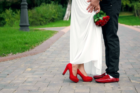 Male and female legs during a dateの写真素材