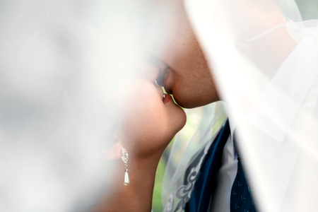 Guy and girl kiss large lips lips silhouettes. The guy is kissing the girl.の写真素材