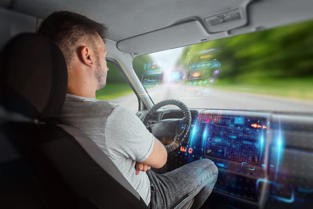 A man in an autonomous car. Self-driving. Concept autopilot, automotive engineering, artificial...