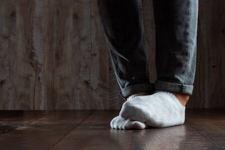 The legs of a man close up, stink. Nasty smell. Stink legs, fungus on the legs.の写真素材