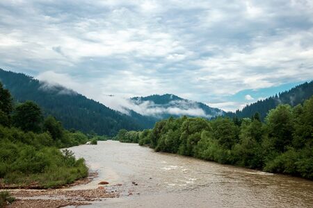 River in the mountains, sky, summer. Ukraine, the Carpathian Mountains. Concept of travel, tourism, holidays, vacation.の写真素材