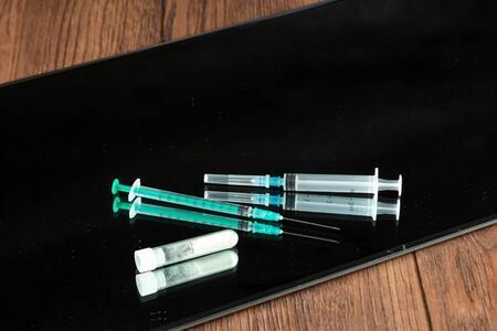 A bunch of different drugs, syringes, pills on the table. Social problem, drug addiction, death, addiction. Copy spaceの写真素材