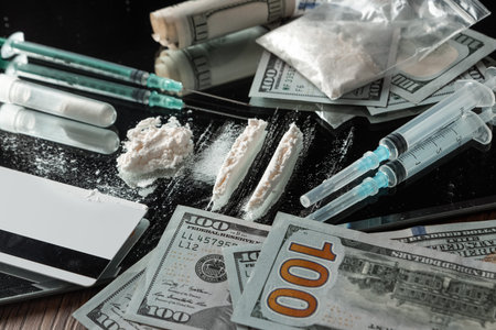 A bunch of different drugs, syringes, pills on the table. Social problem, drug addiction, death,...