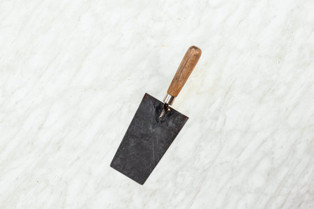 Brick trowels lie on a light background top view. copy space. Concept construction building repair
