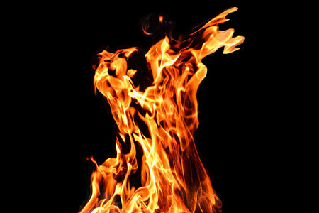 Fire, flames on a black background isolate. Concept fire grill heat weekend barbecue
