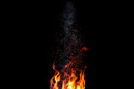 Sparks from a fire on a black background isolate.