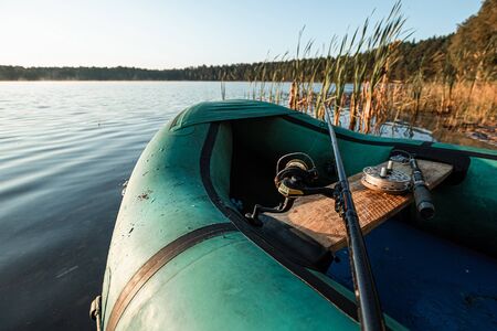 Inflatable boat on the lake at sunrise.の写真素材