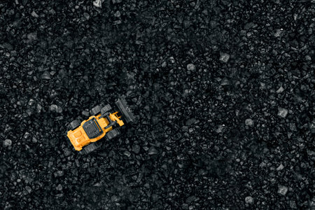 Open pit coal mining, transportation and logistics, top view. Fossil fuels, environmental pollution