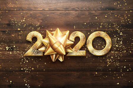 Golden New Year 2020 sign on a wooden background. happy new year, merry christmasの写真素材