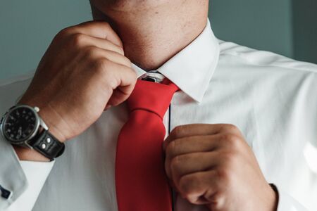 Hands of a businessman, close-up, tie, bow tie.の写真素材